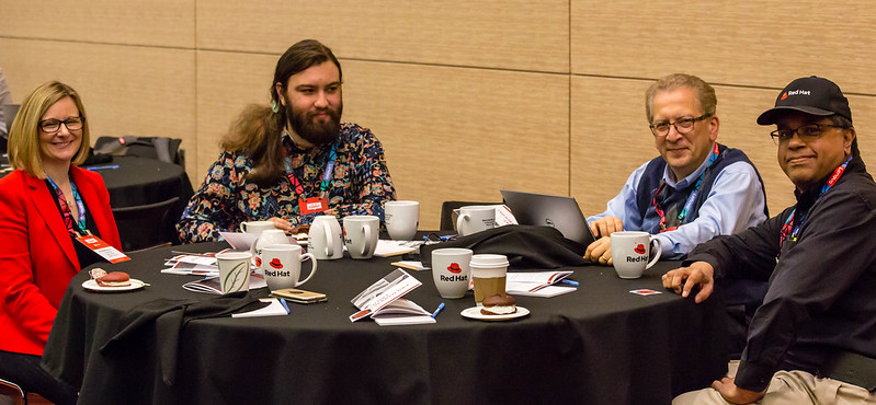 One woman and three men sitting at the table at Research Day US 2019