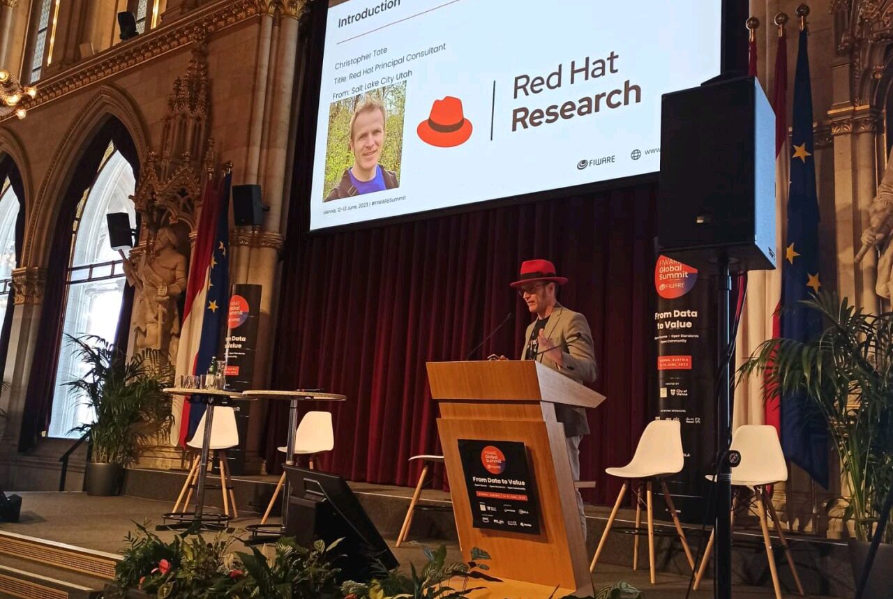 Chris Tate presenting about Red Hat Research at the FIWARE Summit in Vienna, Austria City Hall