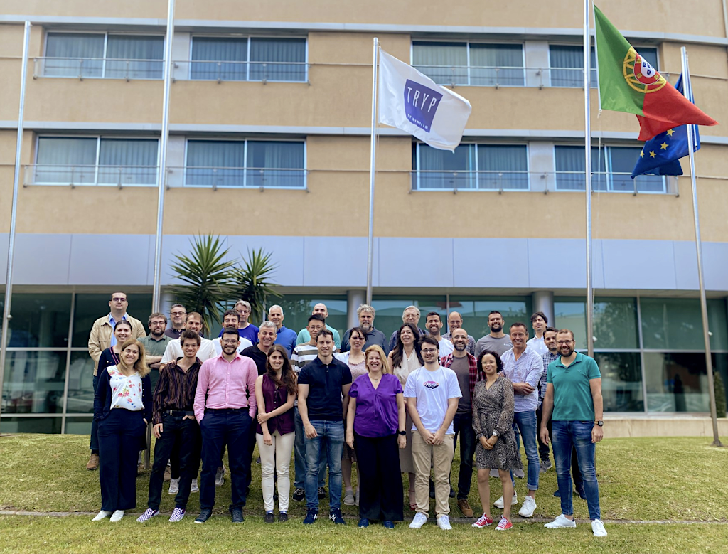 More than 30 members of the CODECO consortium gather for a group photo outside of an INOVA+ building in Portugal